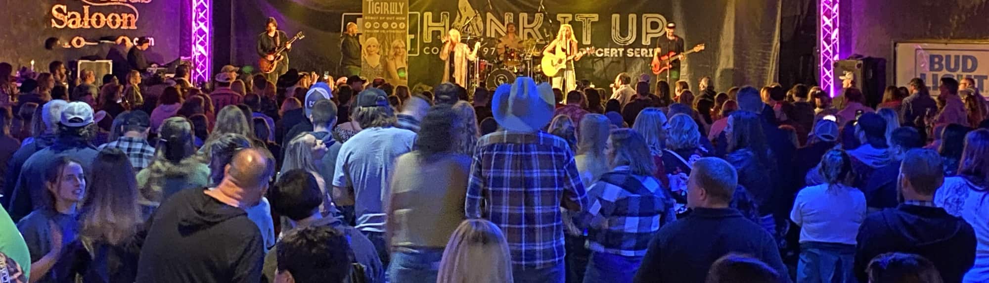 country concert with fans wearing cowboy hats Toledo