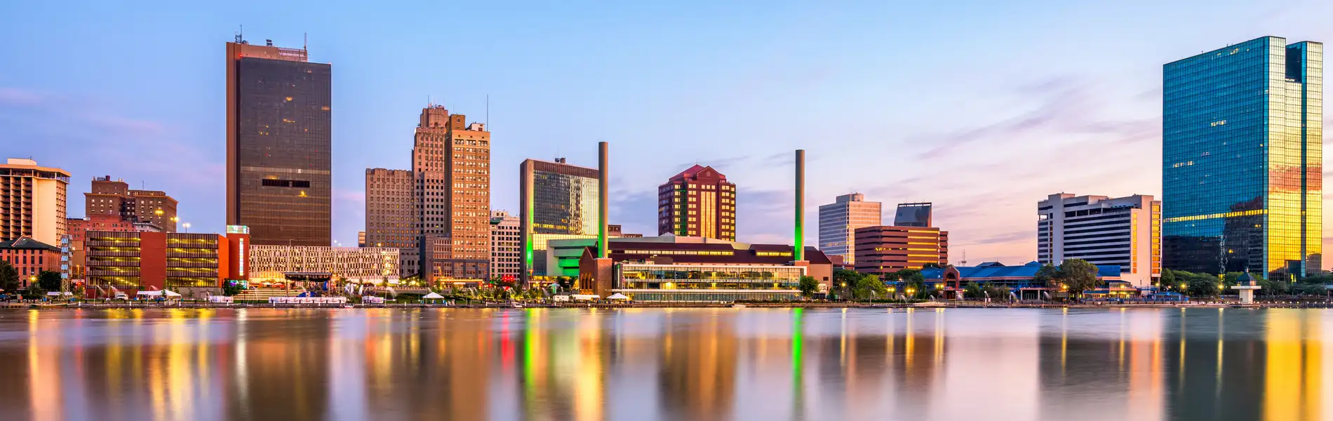 Neon color image of a band playing and people singing along