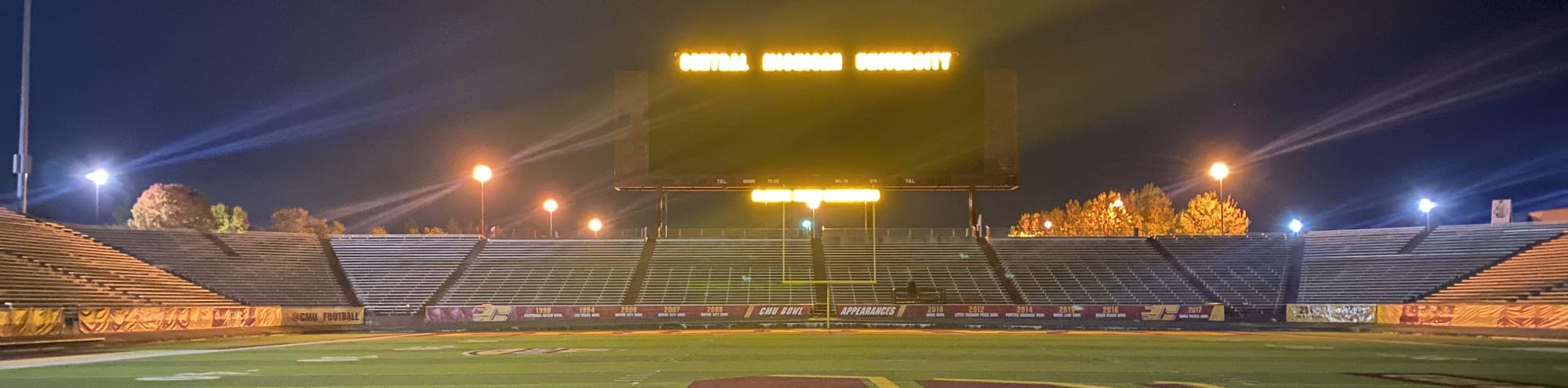 empty football stadium at night under the lights Toledo